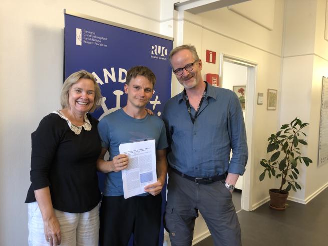 This is a picture of Lone Simonsen, Ulrik Hvid and Morten Frisch standing next to each other.