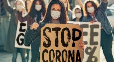 Corona demonstration with sign saying "stop corona"